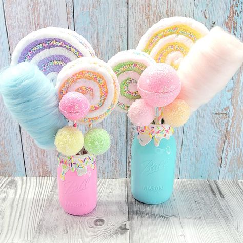 It's here by popular request!! SO many of you reach out ot me about these candy centerpieces and want to have it all.  These are the perfect candyland centerpieces for and Candy themed party, event or just some sweet décor. Well now it's here and you can get the pint size, quart size centerpieces or both pint and quart size centerpieces for a discounted price.  They are even customizable too.   What you are choosing is either the pint size, quart size or both centerpieces. Then you can either get them as they are in the picture OR Customize the colors.  Please see pictures for the color options and message me with your choices.  You can change the color of  The jar  6" lollipop 4" lollipop  3" round lollipop (quart size centerpiece) or 2" round lollipop (pint size centerpiece)  the 2 snowb Sweet Treat Decorations, Candy Theme Table Setting, Sweets Themed Birthday Party Centerpieces, Candyland Candy Table, Sweets Centerpiece Ideas, Candyland Tea Party, Dessert Party Decorations, Sweet One Party Centerpieces, Candy Table Centerpieces For Party