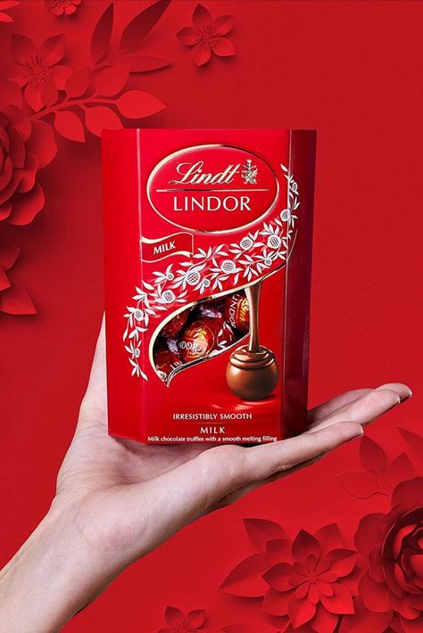 Experience bliss with Lindt Lindor smooth melting milk chocolate truffles. The Lindt Master Chocolatiers combine expertise and the finest ingredients to produce the perfectly round milk chocolate shell with an irresistibly smooth melting filling. The Lindor milk chocolate box is the ideal gift for every occasion, from Valentine's Day to Easter, birthdays and Christmas, as well as being perfect for indulging in a blissful moment all to yourself. Milk Chocolate Truffles, Lindor Chocolate, Truffle Boxes, Lindt Lindor, Lindt Chocolate, Chocolate Shells, Valentines Ideas, Chocolate Truffles, Chocolate Box