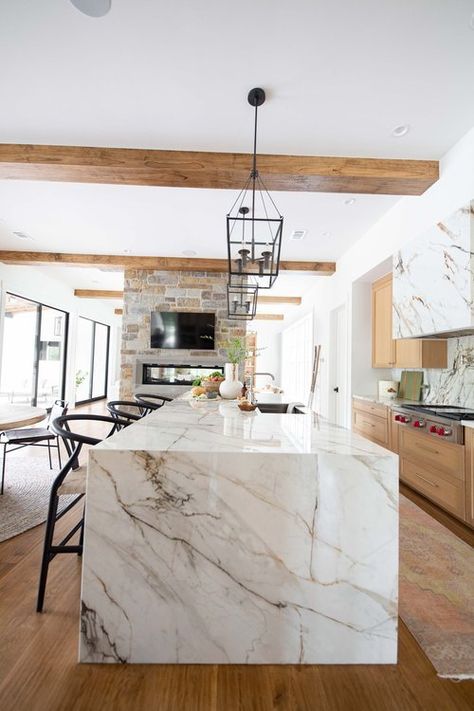 Waterfall Island With Cooktop, Two Tone Island Countertop, Porcelain Waterfall Island, Statement Island Countertop, Quartz Island Waterfall, Kitchen Island Stone Ideas, Waterfall Granite Island, Light Stone Countertops, Quartz Waterfall Countertop