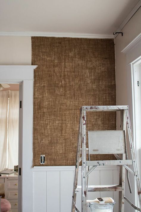 When I was planning out my living room, I knew I needed to add texture somewhere and I ultimately decided the walls were the perfect place! While the bottom half had wainscoting, I was able to add burlap to the top half, adding a unique feature to the room!   Before I started, my room looked like this.   I started by making the "glue" that would hold the burlap to the walls, which is basically just 1 part cornstarch to 8 parts water. You'll note there are a ton of lumps in my glue. It… Diy Burlap Decor Ideas, Burlap On Walls, Covering Osb Walls, Wall Finishes Ideas Diy, Burlap Wall Covering, Wall Covering Ideas, Burlap Wallpaper, Glitter Bathroom, Mom Room