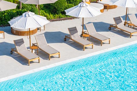 Umbrella and deck chair around outdoor swimming pool in hotel resort by siraphol. Umbrella and deck chair around outdoor swimming pool in hotel resort nearly sea beach ocean for travel vacation #Sponsored #swimming, #pool, #hotel, #outdoor Pool With Umbrella, Hotel Marbella, Umbrella Chair, Pool Hotel, Pool Umbrellas, Hotel Resort, Deck Chairs, Outdoor Swimming, Sea Beach