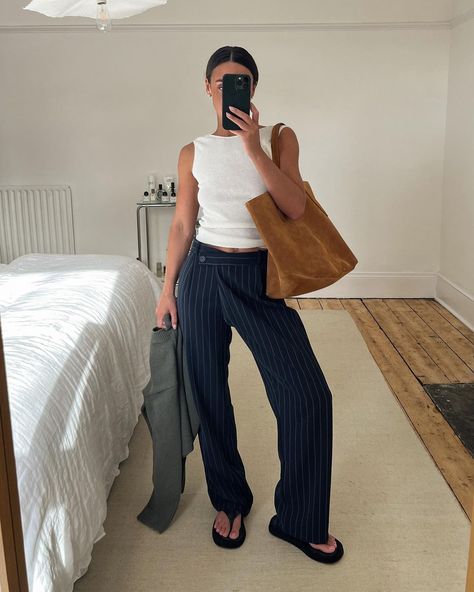 Emily on Instagram: "Last years @zara knit top & pinstripe pants paired with my new suede @littleliffner tote, weather is unpredictable but when the suns out…" Pin Stripe Pants Outfit, Blue Striped Pants Outfit, Pinstripe Trousers Outfit, Striped Trousers Outfit, Pinstripe Pants Outfit, Navy Pants Outfit, Blue Pants Outfit, Stripe Pants Outfit, Zara Knit Top