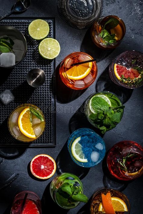 Cocktails set on black bar counter, top view. Mixology concept. Assortment of colorful strong and low alcohol drinks for cocktail royalty free stock Bar Counter Top, Make Step By Step, Low Alcohol Drinks, Orange Cocktails, Cherry Liqueur, Green Bar, Cocktail Desserts, Cocktail Set, Alcohol Drinks