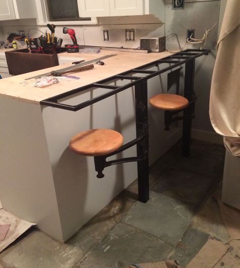 welded frame that supports countertop overhang and stools in our kitchen Attached Bar Stools Kitchen Island, Wall Mount Bar Stools, Attached Bar Stools, Counter Overhang, Island Overhang, Kitchen Island Overhang, Countertop Overhang, Rustic Industrial Dining Table, Welded Bar Stools