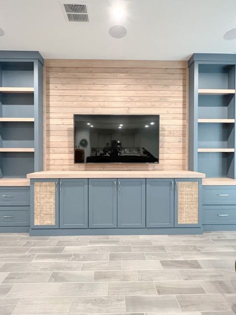 This custom hand built entertainment center spans almost 23 feet in width and is 11 feet tall. It has six cabinet doors, two of which were custom speaker friendly by design. The eight soft close cabinet drawers allow for tons of additional storage. The countertops, shelves and real wood shiplap are all stained to coordinate with the Magnolia color Storm Chaser. We loved how this project turned out and our clients were thrilled! Entertainment Center With Speakers Built Ins, Entertainment Center Storage, Tv Entertainment Center Ideas Diy, Built In Tv Wall Unit High Ceiling, Diy Entertainment Center Plans, Shiplap Entertainment Center, Custom Built In Entertainment Center, Tall Cabinets Living Room, Custom Entertainment Center Built Ins