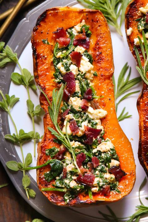 Stuffed Butternut Squash with Feta Cheese, Spinach, and Bacon - on a white plate. Stuffed Butternut Squash, Butternut Squash Spinach, Stuffed Butternut, Spinach And Bacon, Best Thanksgiving Side Dishes, Vegan Feta Cheese, Cheese Spinach, Butternut Squash Recipes, Thanksgiving Side