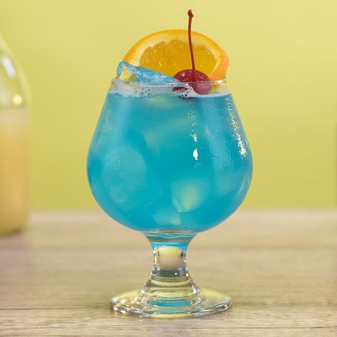 BLUE OCEAN 1 oz (30ml) Vodka 1/2 oz. (15ml) Blue Curaçao 1/2 oz.(15ml) Simple Syrup  2 oz. (60m) Grapefruit Juice Garnish: Orange Slice, Cherry  PREPARATION 1. In a shaking glass with ice, combine vodka, blue curaçao, simple syrup, and grapefruit juice. Shake well.  2. Strain mix into a Brandy snifter over ice and garnish with an orange slice and a cherry.  DRINK RESPONSIBLY! Ocean Drink, Ocean Cocktail, Blueberry Martini, Vodka Mixers, Classic Vodka Cocktails, Vodka Blue, Cherry Drink, Brandy Snifter, Raspberry Vodka