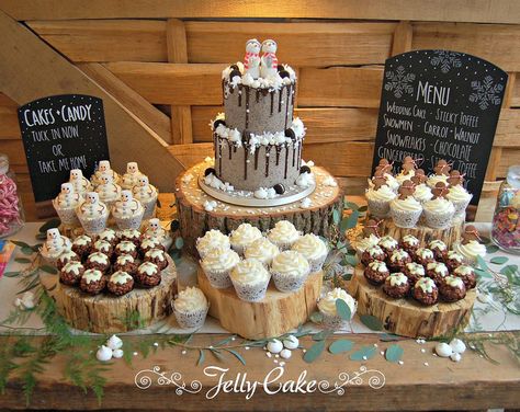 The full dessert table for Chloe and Jay's wedding at Cripps Barn, Bibury. A two tier cake, cupcakes with gingerbread men, snowmen and snowflake decoration and chocolate rice krispie Christmas puds. Christmas Wedding Dessert Table, Winter Dessert Table, Dessert Table Ideas, Christmas Wedding Cakes, Toffee Cake, Christmas Dessert Table, Cupcake Stand Wedding, Tie The Knot Wedding, Two Tier Cake