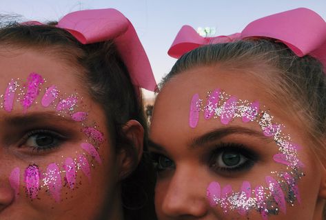 Student Section Face Paint Ideas, Pink Out Ideas Spirit Week, Powderpuff Hair Ideas, Pink Out Dress Up Day School, Fiesta Pep Rally, Pink Out Hair Spirit Week, Face Paint Designs For Football Games, Spirit Day Face Paint Ideas, Pinkout Ideas Outfits Football Game