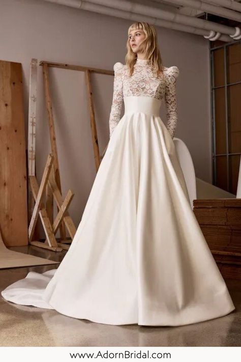 Show off your timeless bridal style in this mock neck long sleeve wedding dress. An Alyne by Rita Vinieris wedding dress offers you a chic feminine wedding dress with playful details. This corded lace wedding gown embodies modern elegance that’s both striking and understated. This full ballgown wedding dress, available at Adorn Bridal Nashville creates an ethereal, romantic feel. Click the link to shop this mock neck wedding dress today! Rita Vinieris Wedding Dress, Mock Neck Wedding Dress, Alyne By Rita Vinieris, Rita Vinieris, Ballgown Wedding Dress, Wedding Dress Silhouette, Feminine Wedding, Ballgown Wedding, Iconic Weddings