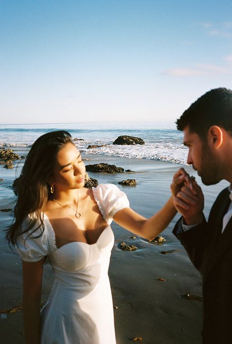 Italian Inspired El Matador, Malibu Engagement Shoot Beach Dress Engagement Photos, Malibu Engagement Shoot, Engagement Shoot At The Beach, White Dress Beach Photoshoot Couple, Malibu Engagement Photos, Italian Engagement Photos, White Dress Couple Photoshoot, White Dress Engagement Pictures, Ocean Elopement