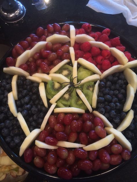 Spider web fruit tray for Halloween party Fruit Tray For Halloween Party, Spidey Fruit Tray, Fruit Tray Halloween, Spider Man Fruit Tray, Halloween Veggie And Fruit Trays, Halloween Themed Fruit Tray, Fruit Halloween Tray, Spiderman Veggie Tray, Halloween Party Fruit Tray