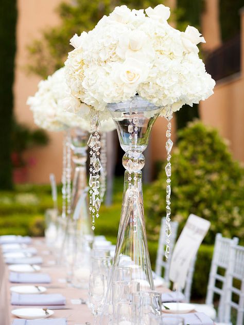 It’s time to take your wedding centerpieces up a notch with decadent sparkles, beaded embellishments and towering vases. Take a look at these 13 glamorous centerpieces with serious bling. Bling Centerpiece, White Floral Centerpieces, Wedding Dresses Cinderella, Cinderella Wedding, Wedding Floral Centerpieces, Bling Wedding, Wedding Flower Inspiration, Mod Wedding, Glamorous Wedding