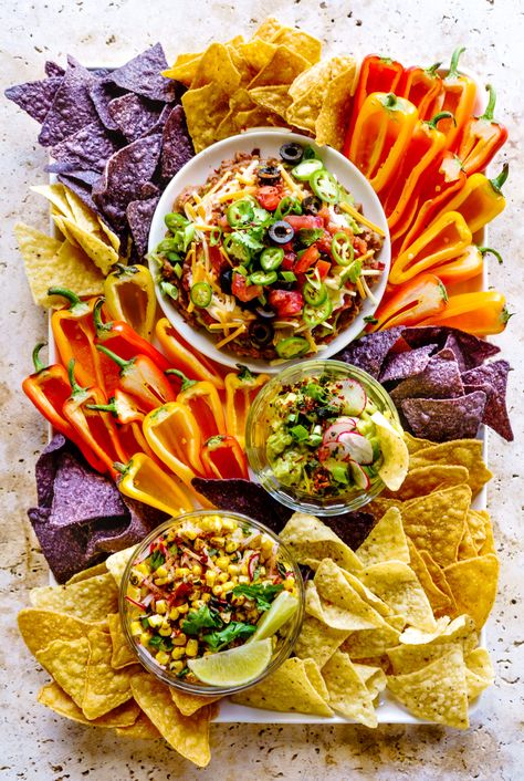 Summer Dip Board with a 7-Layer Bean Dip, Roasted Tomatillo Guacamole and Mexican Corn Dip. Dip Board, Summer Dip, Layered Bean Dip, Roasted Tomatillo, Mexican Corn, Charcuterie Inspiration, Fourth Of July Food, Bean Dip, Charcuterie Recipes