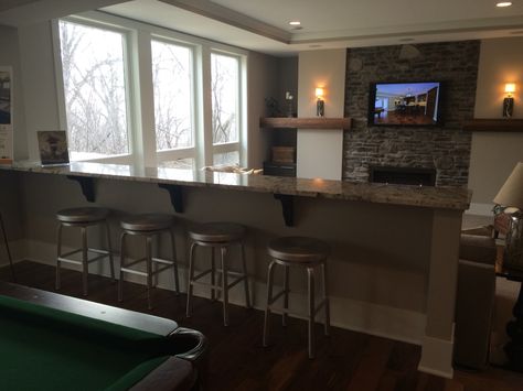 Built on half wall with counter for behind couch? Built In Bar Behind Couch, Basement Bar Table Behind Couch, Bar Seating Behind Couch, Ledge Behind Couch, Half Wall Bar, Rustic Glam Kitchen, Bar Behind Couch, Bar Table Behind Couch, Basement Renovations Ideas