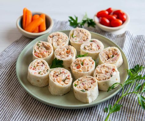 These tasty rolls are simple to make and easy to enjoy — the ultimate party snack. Salmon Tortilla, Salmon Roll Ups, Salmon Pinwheels, Appetizer Wraps, 2023 Meals, Salmon Wrap, Tortilla Pinwheels, Salmon Appetizer, Chicken Of The Sea