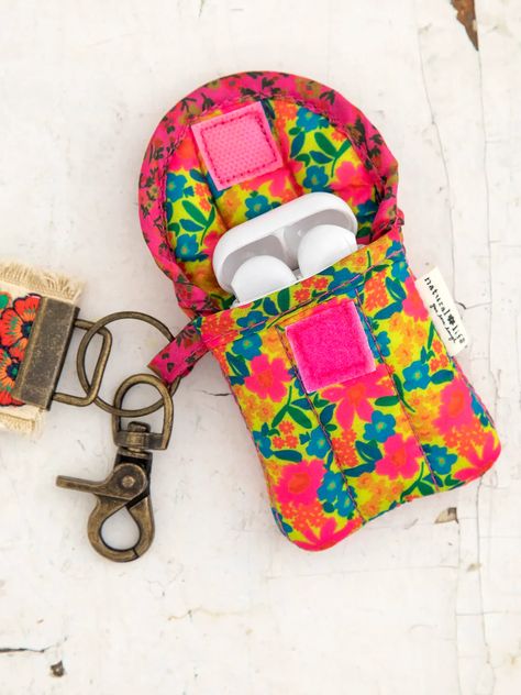 This nylon, quilted Ear Bud Vase holds your Headphones or Air Pods! The velcro closure keeps them secure. Its bright colored print makes it easy to find when it's deep in your bag, or use the little hook so it can attach to anything! Keychain Hook, Ear Bud, Earbud Case, Cute Stockings, Prayer Box, Boho Bags, Easter Shopping, Pink Neon, Natural Life