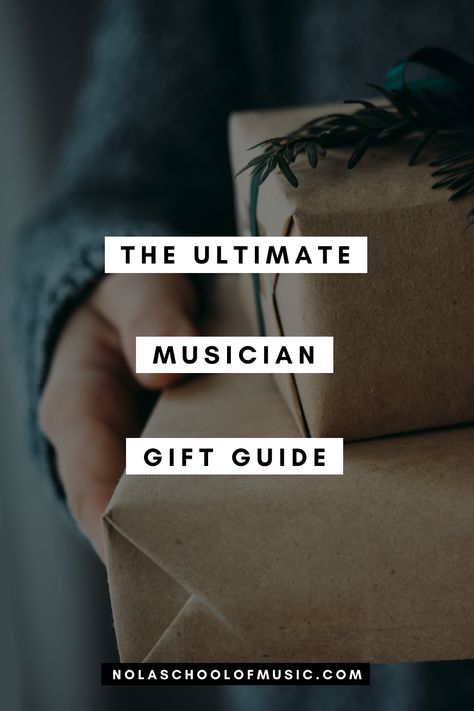 A musician holding a present with a text overlay: The Ultimate Musician Gift Guide Gift Idea For Musician, Gifts For Musicians, Gifts For A Guitar Player, Gifts For Guitar Players, Birthday Gifts For Guitar Players, High School Graduation Gifts, Concert Band, Learn To Play Guitar, Musician Gifts