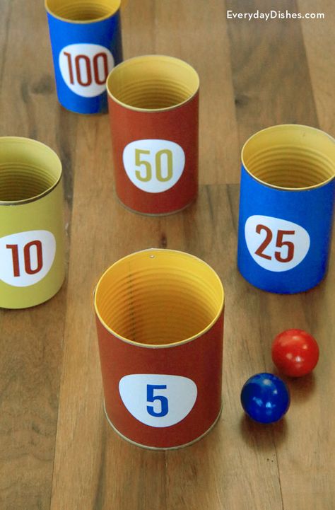 Keep the kids busy on a rainy day! Tin cans, printable scoring labels and ping-pong balls make an indoor toss game the whole family will enjoy. Ping Pong Cup Game For Kids, Awana Activities, Toilet Paper Games, Field Day Games, Bucket Filler, Diy Dish, Charlie Rose, Bowling Games, Fall Games