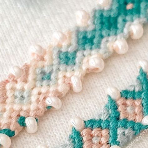 torii on Instagram: "{🌞} first time using beads in my friendship bracelets, and I am loving it!! Lots of people have already been doing this but I can show a tutorial on how I did these here soon :)! - should I make a tutorial on this? Comment yes or no :)! {🌿} #38860 (diamond) #133494 - #smallbusiness #bracelets #friendshipbracelets #shopsmall #supportsmallbusiness #braceletbook #pattern #braceletbookpattern #explorepage #dmccrafts #dmcthread #dmccreations #aesthetic #aestheticbracelets #aestheticfeed" Thread Friendship Bracelets With Beads, Embroidery Thread Bracelets With Beads, How To Add Beads To Friendship Bracelet, Friendship Bracelet With Charm, Friendship Bracelet Patterns Beads, Friendship Bracelet Patterns With Beads, Diamond Friendship Bracelet Pattern, Friendship Bracelet Aesthetic, Friendship Bracelet With Beads