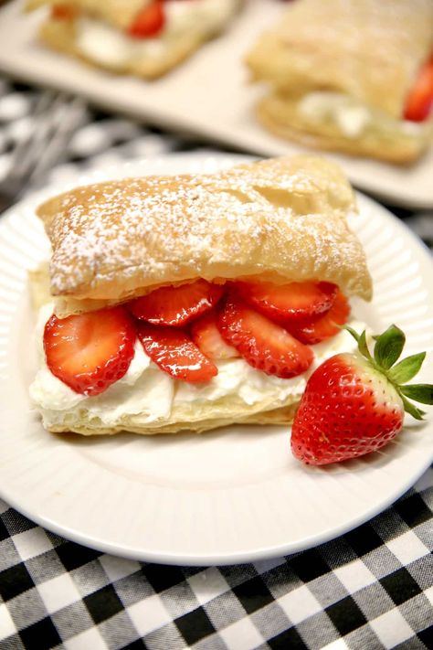 Easy Strawberry Napoleons are a delicious dessert that everyone will love. Flaky puff pastry layered with the easiest pastry cream and fresh strawberries. Strawberries And Cream Puff Pastry, Puffed Pastry Strawberry Dessert, Puff Pastry And Strawberry Recipe, Puff Pastry Strawberry Shortcake, Strawberry Desserts Puff Pastry, Puff Pastry With Strawberries, Strawberry Napoleon Puff Pastries, Puff Pastry Sheet Recipes Desserts, Strawberry Puff Pastry Recipes