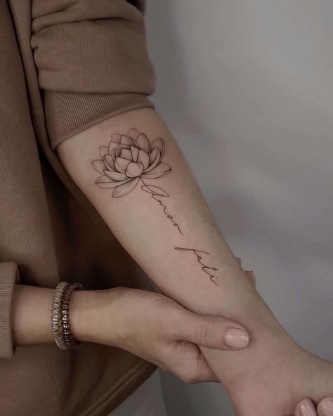 Lotus Tattoo With Words, Delicate Lotus Tattoo, Lutos Flower Tattoo, Simple Lotus Tattoo Design, Lotus Flower With Name Tattoo, Thai Lotus Flower Tattoo, Lotus Flower With Words Tattoo, Lotus Flower With Word Stem Tattoo, Simple Forearm Tattoos For Women