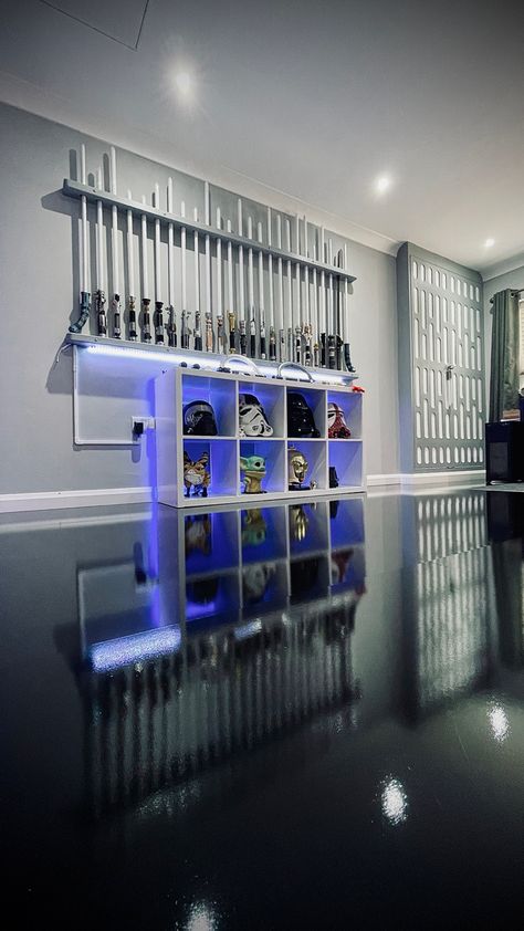 Over 100 lightsabers. Some wall mounted, some displayed in horizontal Kallax. #lightsaber #mancave #saberlife Lightsaber Collection Display, Futuristic Classroom, Lightsaber Wall Mount, Lightsaber Display, Custom Lightsaber, Star Wars Lightsaber, Star Wars Room, Star Wars Light Saber, Star Wars Costumes