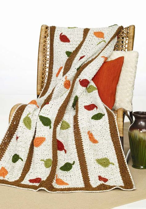 Crochet a beautiful afghan for autumn with colorful falling leaves. This intermediate afghan crochet pattern is worked from side to side beginning at right hand edge. Thanksgiving Crochet, Falling Leaf, Crochet Leaf Patterns, Fall Crochet, Fall Crochet Patterns, Crochet Afghan Patterns Free, Crocheted Blanket, Crochet Afgans, Crochet Blanket Afghan