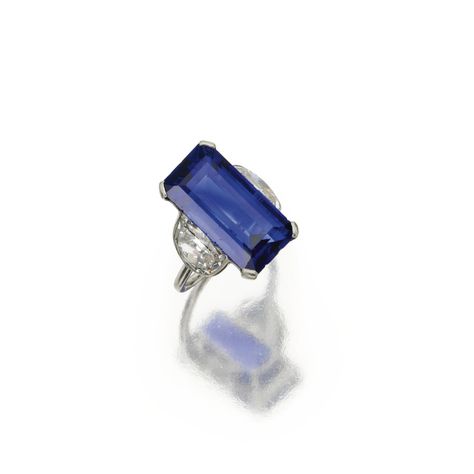 SAPPHIRE AND DIAMOND RING, CARTIER, PARIS, CIRCA 1930. The emerald-cut sapphire weighing 15.42 carats, flanked by 2 half-moon-shaped diamonds weighing approximately 3.40 carats, mounted in platinum, size 6, signed Cartier, Paris, numbered 07423. Bijoux Art Deco, Bijoux Art Nouveau, Vintage Jewlery, Sapphire And Diamond Ring, Ceylon Sapphire, Cartier Jewelry, Bling Rings, I Love Jewelry, Fine Rings