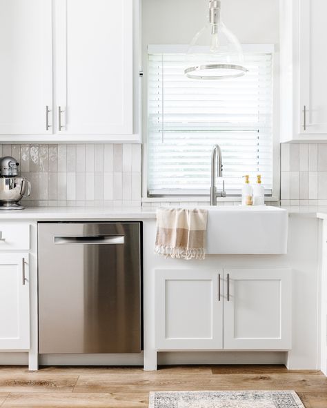 This transformational Tuesday features a new bright kitchen! The all-white cabinets and countertops help reflect natural light to brighten the kitchen. The new cabinet design and backsplash helped shift to a simple, modern look. The vertically stacked zellige tiles are a nod to mid-century style - we love it! @bedrosianstile @buildwithferguson @amazonhome Vertical Stack Tile Kitchen, Transformational Tuesday, White Elegant Kitchen, Amazing Kitchens, Dallas Interior Design, Zellige Tiles, Bright Kitchen, Cabinets And Countertops, Bright Kitchens