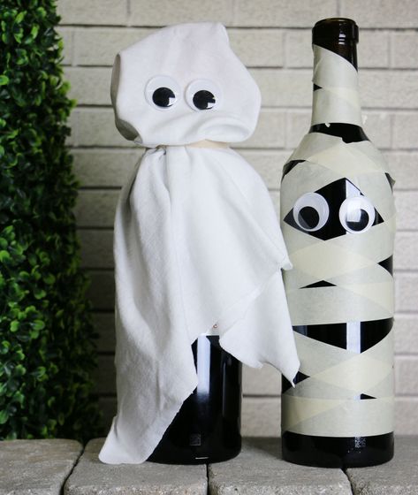 Wine Bottle Halloween Crafts, Beer Bottle Halloween Crafts, Diy Wine Bottle Halloween Crafts, Spooky Wine Bottles Diy, Wine Bottle Mummy, Candy Corn Wine Bottles Diy, Diy Halloween Decorations Wine Bottles, Water Bottle Crafts Diy, Mummy Wine Bottle