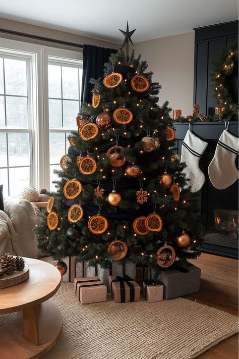 Into warm, cozy Christmas decor? Black and orange is a unique pairing that adds warmth to the room. Dried orange slices and amber lights create a natural, earthy touch that feels festive and homey. Perfect for anyone looking for something different. Would you try this citrusy look? Amber Christmas Tree, Warm Cozy Christmas, Christmas Decor Black, Amber Christmas, Orange Christmas Tree, Christmas Tree Colour Scheme, Christmas Tree Idea, 2025 Ideas, Black Christmas Tree