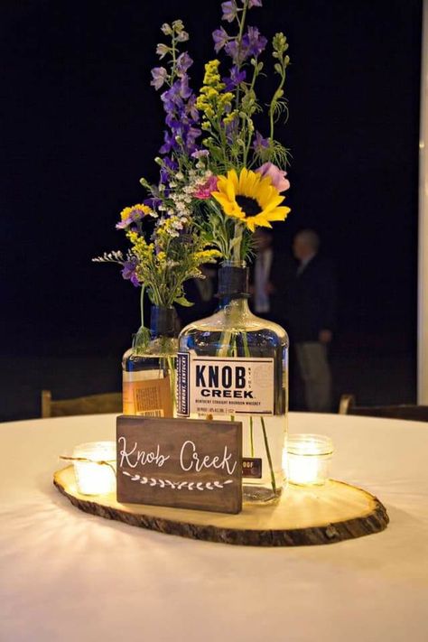 Beer Bucket Centerpiece Ideas, Whisky Bottle Centerpiece Wedding, Bourbon Bottle Centerpiece Wedding Ideas, Bourbon Bottle Centerpiece, Liquor Bottle Centerpieces, Whiskey Bottle Centerpiece, Bucket Centerpiece Ideas, Bourbon Wedding, Bucket Centerpiece