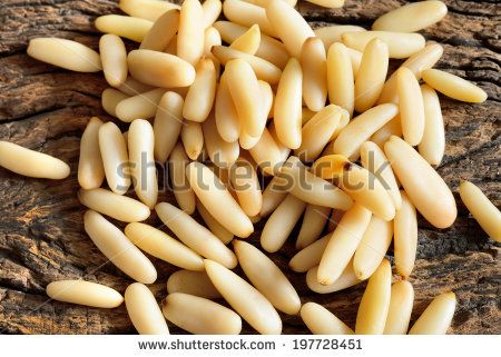 fresh peeled pine nuts on wooden table by enzodebernardo, via Shutterstock Pine Nuts Benefits, Indian Spices List, Nuts Benefits, Pine Seeds, List Of Spices, Pasta Al Pesto, Pine Nut, Superfood Recipes, Fruit Photography