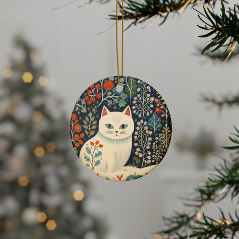 White Cat Ornament in Scandinavian Print  .: Same design printed front and back .: Material: 100% Ceramic .: Available as a single ornament and in bundles of 3, 5 or 10 pieces .: Glossy finish .: Four shapes to choose from .: Includes gold string for hanging Art Ornaments, Scandi Folk Art, Christmas Painted Ornaments, Scandinavian Christmas Design Folk Art, Scandinavian Christmas Tree Art, Painted Wood Ornaments, Scandinavian Cat Illustration, Cat Xmas Ornaments, Scandinavian Christmas Ornaments