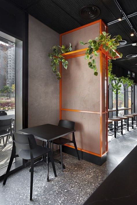 Student Restaurant Design, Black And Orange Restaurant Interior, Black And Orange Office Interior Design, Concrete Restaurant Design, Orange And Blue Restaurant Interior, Orange And Black Interior Design, Orange And Black Interior, Hamburger Restaurant Design, Orange Restaurant Interior