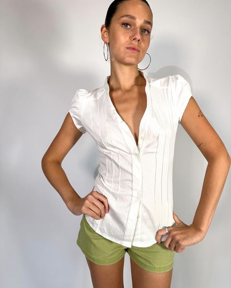 Vintage Deadstock short Cap Sleeve White shirt in amazing subtle stripe stretch fabric for a snatched fit! This is the perf corporate baddie , office siren piece ! Available in size XS, S, M & L . Model wears size S . $78 free postage australia wide . . . #whiteshirt #pinterestoutfit #vintagefashion #y2kfashion #pinterestasthetic Fitted Blouses For Women, Office Siren Shirt, Baddie Office, Blouse Outfit Work, Short Sleeve Shirt Outfit, White Blouse Outfit, Form Outfits, Uni Fits, Sixth Form Outfits