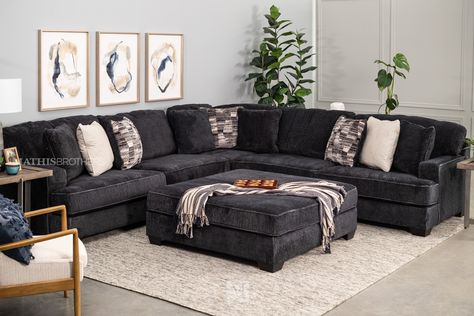 Utilize the versatility of the Lavernett Square Ottoman in charcoal to upgrade your living room space. Simple and straightforward, it boasts a square silhouette that is firmly cushioned and covered with soft microfiber for maximum comfort. Use it like a center table to display decorative pieces or rest your legs by placing it next to an accent chair. Charcoal upholstery is sure to blend well with most interior color palettes for a cohesive look. | Ashley Lavernett Square Ottoman in Charcoal | Ma Large Ottoman Living Room, Charcoal Sofa Living Room, Gray Room Ideas, Interior Color Palettes, Gray Interior Design, Color In Interior Design, Black Sofa Living Room Decor, Dark Grey Couch Living Room, Gray Room