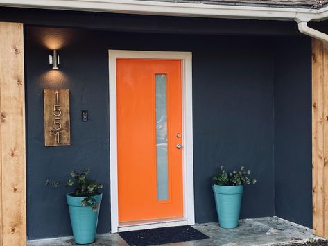 Blue House Orange Door, Dark Blue House Exterior, Grey Brick Houses, Dark Grey Houses, Navy Blue Rooms, Colored Door, Dark Blue Houses, Teal House, Orange Front Doors