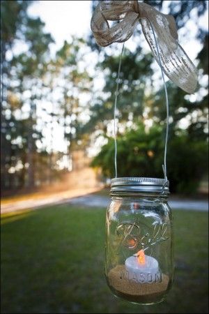 hanging mason tea light holders, great for an outdoor parties. We use these in the trees between our house and our neighbors' house, string some Christmas lights and cal it "the grove." We have a lot of parties there on warm nights. Mason Jar Hanging, Jar Hanging, Mason Jar Tea Lights, Mason Jar Candle Holders, Mason Jar Lanterns, Mason Jar Projects, Hanging Mason Jars, Upcycle Garden, Jar Candle Holder