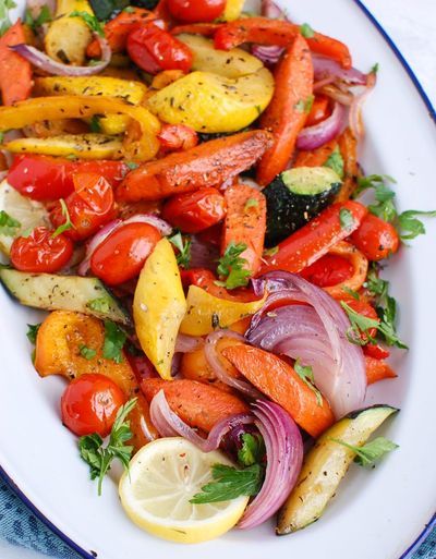 Mediterranean Roasted Vegetables are bursting with the sweet flavors that happen when you roast vegetables. The rainbow of vegetables are seasoned with oregano, thyme and a squeeze of lemon juice. These are the perfect vegan side dish to pair with grilled meats, add to a rice bowl or a healthy side dish. Full Dinner Meals With Sides, Mediterranean Roasted Vegetables, Side Dishes For Fish, Rainbow Veggies, Roast Vegetables, Spring Food, Random Recipes, Roasted Vegetable Recipes, Grilled Meats