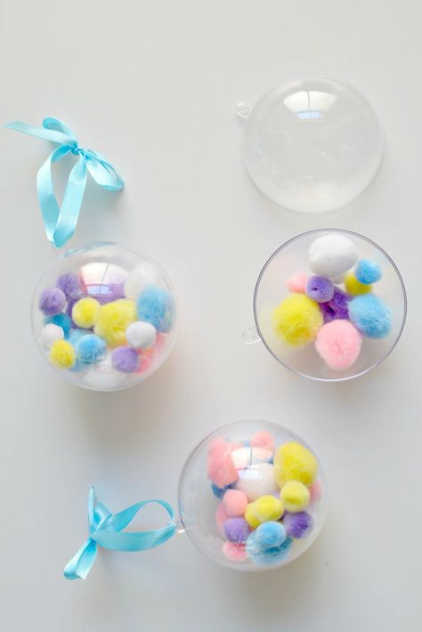 burkatron: diy | pom pom christmas baubles Pom Pom Baubles, Pastel Christmas Ornaments Diy, Homemade Baubles Kids, Diy Ornament Clear Ball, Unicorn Glitter Ornament Diy, Fillable Baubles, Pom Pom Christmas, Pompon Diy, Pom Pom Decorations