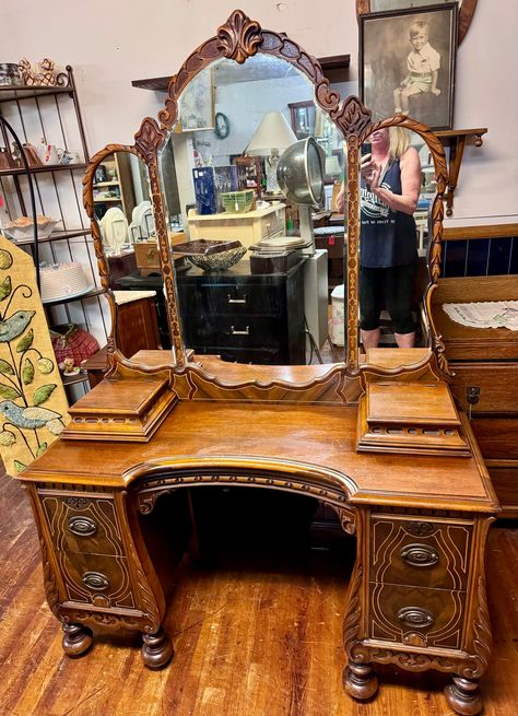 Beautiful 1920's antique Art Deco Neo Classical vanity with triple mirror and vanity chair.  Four deep drawers, dovetail construction with original brass hardware, the drawers have a slight bombay curve to them with wood molding all around.  Two jewelry boxes on top.  Bun feet, lots of carving, embellishments and beautiful detail.  46 x 18 x 27 and vanity chair measures 26 x 16 x 18 x 24".  Matching armoire and dresser available.   Very good original condition.   Free shipping to the West Coast, Unique Vintage Furniture, Antique Vanity Desk, Medieval Vanity, Thrifted Vanity, Wooden Vanity Bedroom, 2000s Furniture, Funky Vanity, Antique Makeup Vanity, Vanity Room Ideas