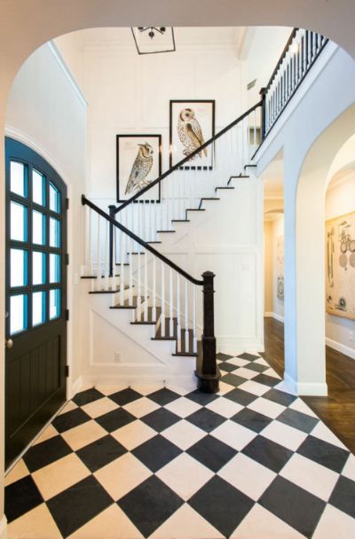 31 Houses With Black Front Entry Door Ideas - | Sebring Design Build Black And White Hallway, Black Staircase, Classic Carpet, Wood Stair Treads, Carpet Staircase, White Hallway, Entryway Tile, White Staircase, Foyer Flooring