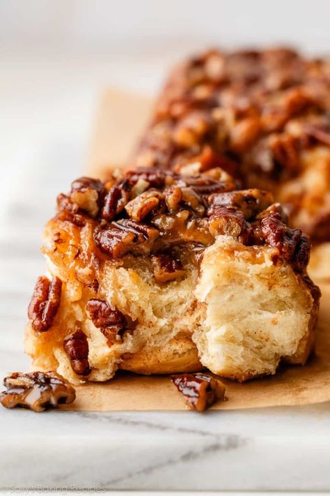 Breakfast has never been more indulgent! These are my glorious make-ahead maple pecan sticky buns, made with pure maple syrup in the caramel glaze topping. They're as flaky and soft as my overnight cinnamon rolls, but with an ooey-gooey pecan layer that becomes the topping. Make ahead brunch recipe on sallysbakingaddiction.com Pecan Cinnamon Rolls Recipe Sticky Buns, Pecan Rolls Recipe, Maple Sticky Buns, Cinnamon Sticky Buns, Make Ahead Brunch Recipes, Pumpkin French Toast Casserole, Overnight Cinnamon Rolls, Pecan Cinnamon Rolls, Make Ahead Brunch