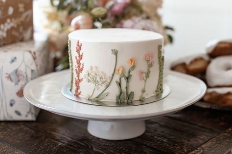 Wild One Flower First Birthday Cake, Wildflower Birthday Backdrop, 1st Birthday Garden Party Ideas, First Bloom Birthday, First Birthday Spring Theme, First Birthday Floral Theme, Wildflower 1st Birthday Photoshoot, 1st Birthday Wildflower Theme, Wild One Floral First Birthday