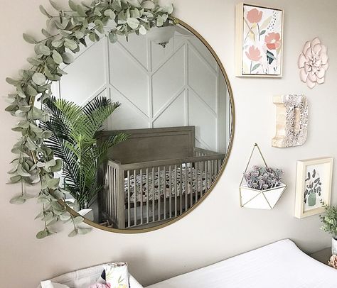 easy way to spice up a simple mirror Gallery Wall With Round Mirror Nursery, Circle Mirror With Flowers, Nursery Wall Decor With Mirror, Circle Mirror Nursery, Gold Circle Mirror Living Room, Mirror With Greenery Around It, Round Mirror Decor Ideas Bedrooms, Greenery Around Mirror, Round Mirror With Flowers