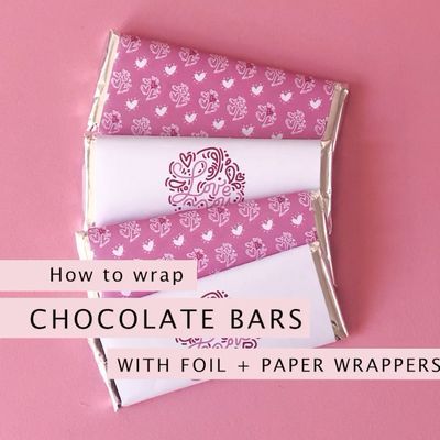 How to wrap chocolate bars in foil and printable paper wrappers. Wrappers are a great way to add customisation to party favours and tie a theme in. Here’s a quick demo on how I put together my Love You Script chocolate bars for Valentines Day. | A Visual Merriment #hersheys #choclatebarwrappers #loveprintables #weddingprintables #chocolate #partyfavors Wrapping Chocolate Bars, Diy Chocolate Bars, Wrappers Diy, Homemade Chocolate Bars, Chocolate Bar Wrapping, Hershey Bar Wrappers, Chocolate Pack, Chocolate Wrapping, Chocolate Bar Wrappers