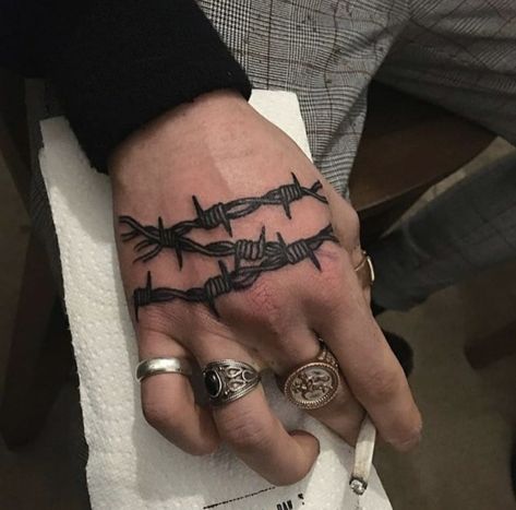 Barbed wire tattoo on the right hand Barbed Wire Tattoo, Wire Tattoo, Traditional Hand Tattoo, Simple Hand Tattoos, Side Hand Tattoos, Barbed Wire Tattoos, Tattoo On Wrist, Knuckle Tattoos, Small Hand Tattoos