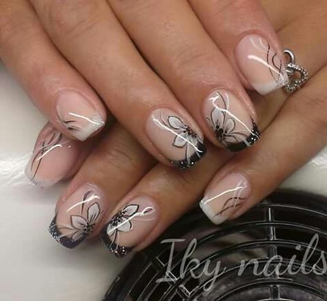 Black and white french nails with hand painted flowers Black And White Nails With Flowers, Black Nails Flower Design, Black Nails With White Flowers, Black And White French Nails, Black Flower Nails, Nails Inspiration Black, Nail Flowers, Black And White French, White French Nails